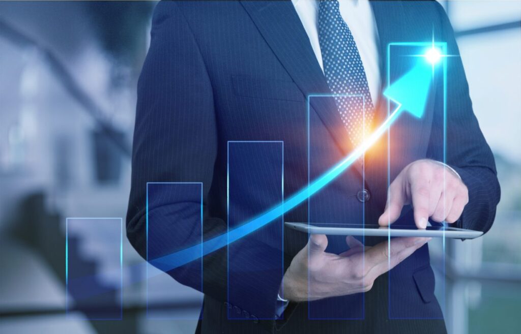 business growth chart on tablet showing upward financial trend and performance metrics