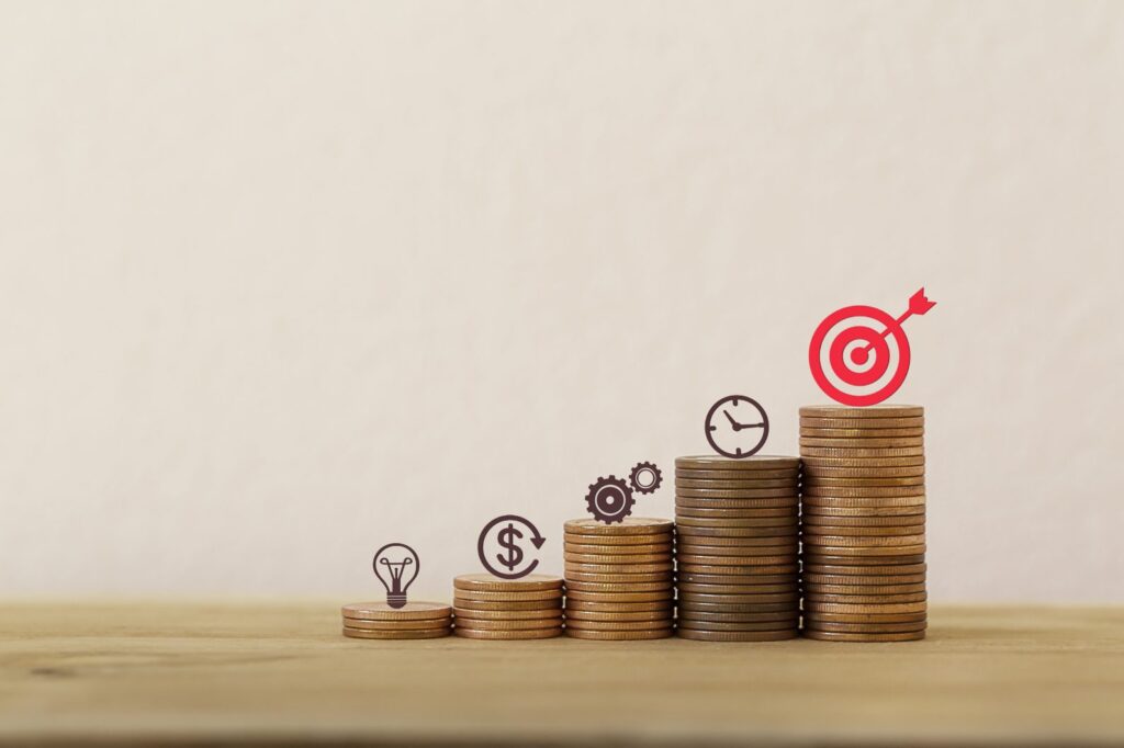 financial growth strategy with coin stacks, target goal, and business success icon